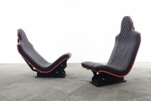 Simforge Apex sim racing seats in black premium Leather in F1 Seating Position (Left) and Truck Simulator Seating Position (Right)