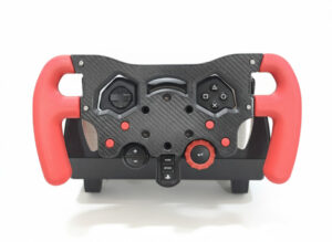 F1 wheel mod for the Logitech G29, featuring a 3D-printed body with a carbon fiber vinyl wrap and matte red grips, designed for F1 simulator racing in India