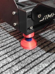Simforge Spring Isolation Feet for sim racing rigs to reduce floor vibration.